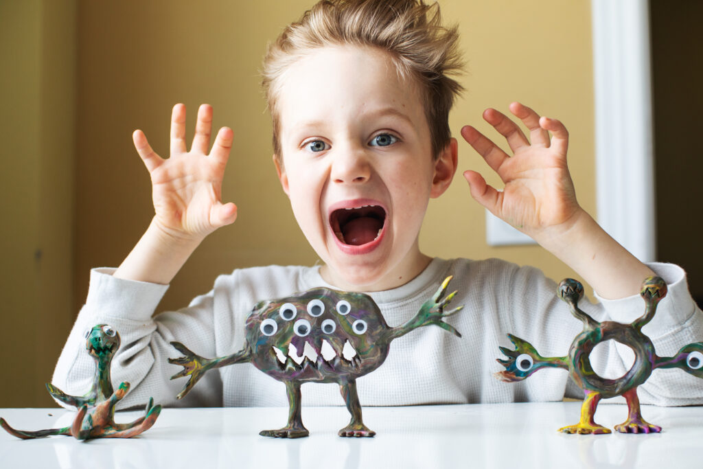 boy-with-clay-monsters-art-therapy
