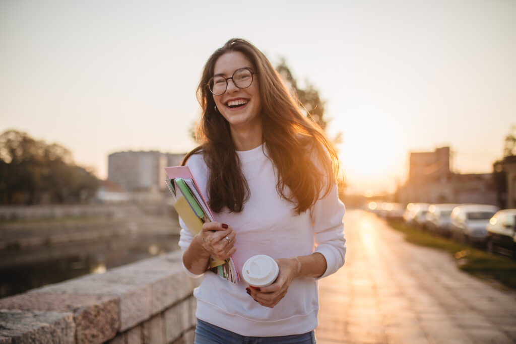 website-teen-girl-with-notebooks-and-coffee-